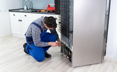 Refrigerator repair technician